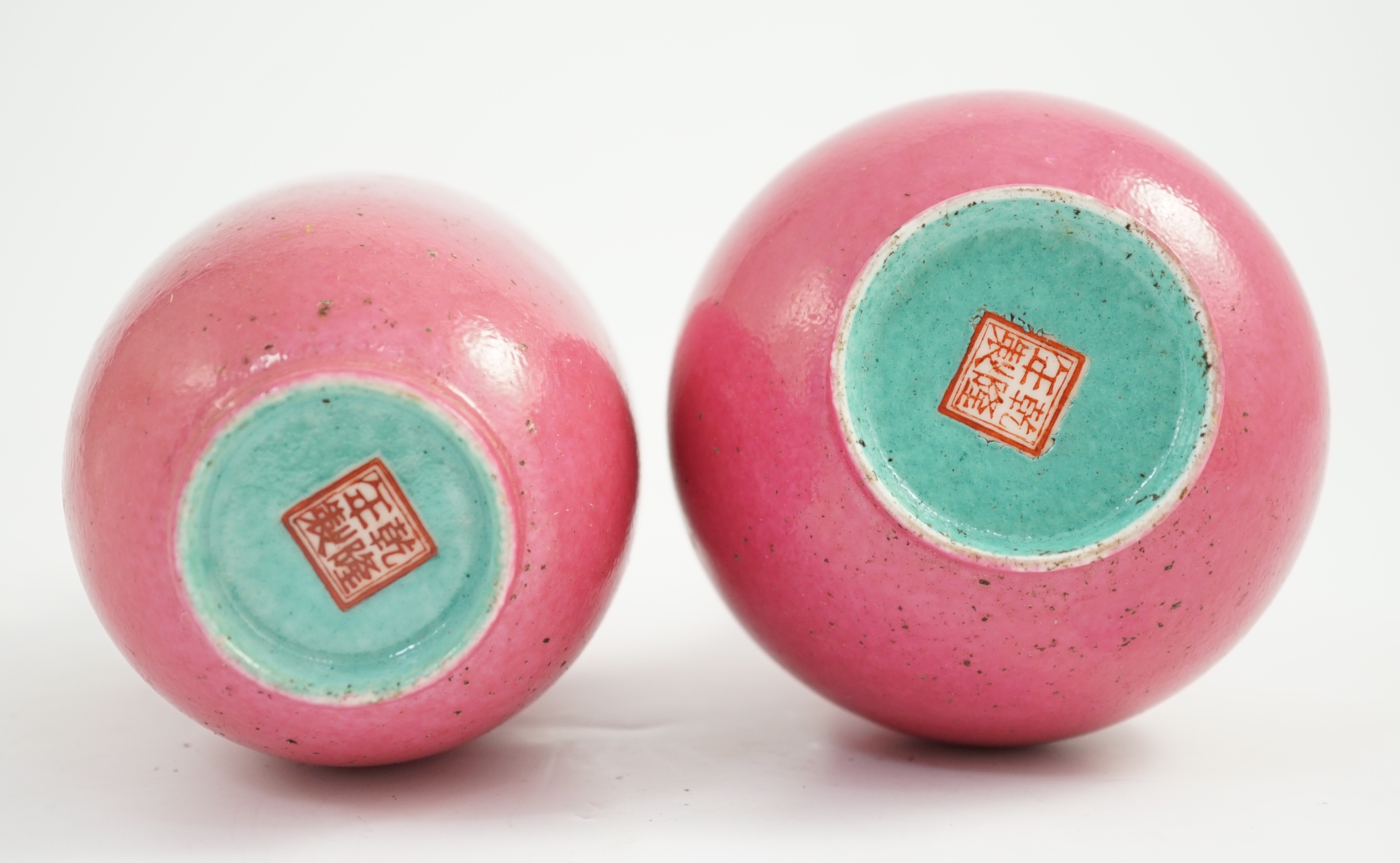 Two Chinese ruby ground vases, possibly Republic period, each with a printed four character Qianlong mark, 18.5 and 19.4cm high